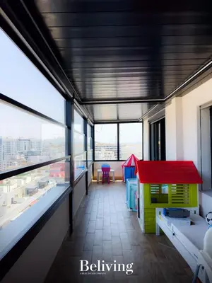 a room with a toy house in a building at Luxurious penthouse with sea view in Oulad Akkou
