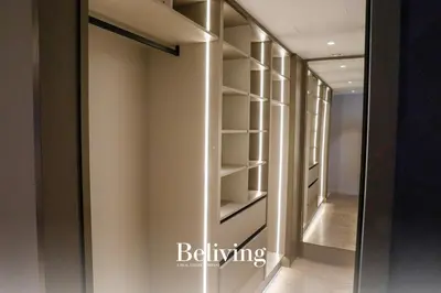 a walk in closet with a mirror and a hallway at Luxury, private pool and sea view in Oulad Akkou