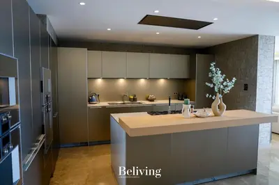 a kitchen with a large island in the middle at Luxury, private pool and sea view in Oulad Akkou