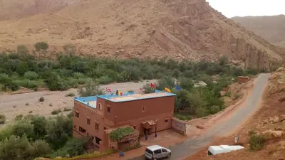 an aerial view of a building in the desert at Gite le Calme café Restaurant Pizzeria in Bou Tharar