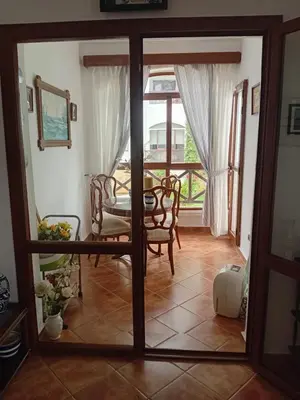 a view of a dining room with a table and chairs at Chic appartement costa cabo in Oulad Akkou