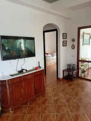 a living room with a flat screen tv on a wall at Chic appartement costa cabo in Oulad Akkou