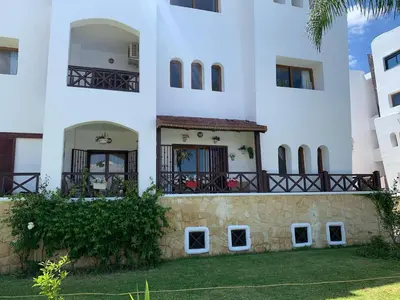 an external view of a building with a balcony at Chic appartement costa cabo in Oulad Akkou