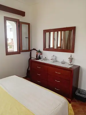 a bedroom with a sink and a mirror at Chic appartement costa cabo in Oulad Akkou