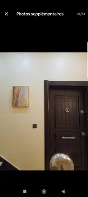 a room with a door and a picture next to it at تجزئة الباهية in Meknès