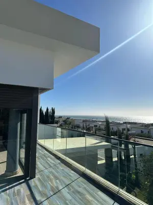 a view of the ocean from the balcony of a house at Taghazout Bay Villa AMDA in Oulad Akkou