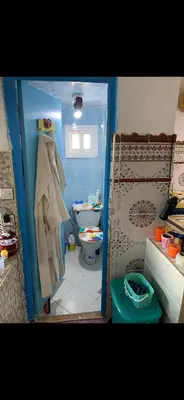 a small bathroom with a toilet and a sink at Apartment a louer sur targha tetouan in Oulad Akkou