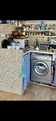 a kitchen with a washing machine in a kitchen at Apartment a louer sur targha tetouan in Oulad Akkou