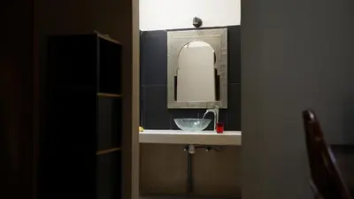 a bathroom sink with a mirror and a bowl on it at Villa Zazate in Ouarzazate