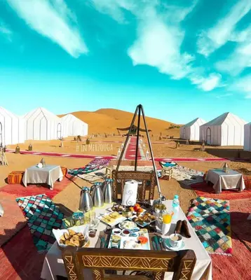 a table with food on it in the desert at Azul desert camp in Merzouga