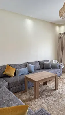 a living room with a couch and a coffee table at Villa Azoul in Tiguemmi n Oumzil et Tnine