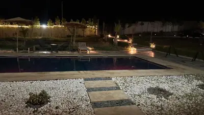a swimming pool in a yard at night at Villa Azoul in Tiguemmi n Oumzil et Tnine