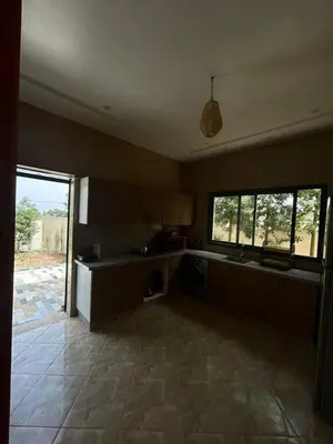 a kitchen with a sink and a counter top at Villa Azoul in Tiguemmi n Oumzil et Tnine