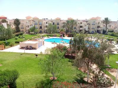an aerial view of a resort with a swimming pool at appartement duplex a saidia in Oulad Akkou