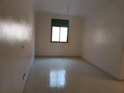 an empty room with a window and a tiled floor at Chwiter Marrakech in Chouiter