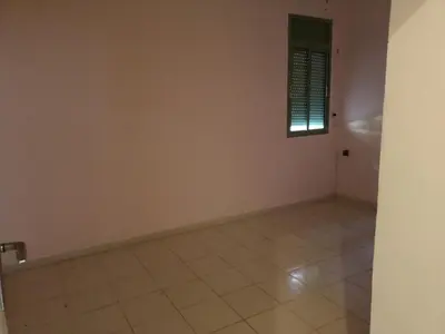 an empty room with a window and a tile floor at Chwiter Marrakech in Chouiter