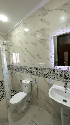 a bathroom with a toilet and a sink at Casa Arabica in Oulad Akkou