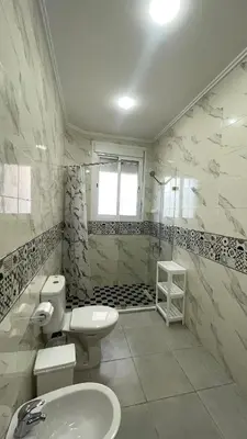 a bathroom with a toilet and a sink and a shower at Casa Arabica in Oulad Akkou