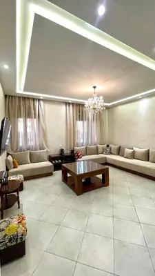a living room with a couch and a table at Casa Arabica in Oulad Akkou
