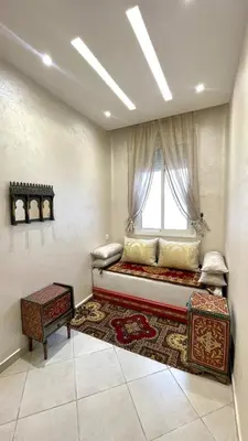 a large room with a bed and a window at Casa Arabica in Oulad Akkou