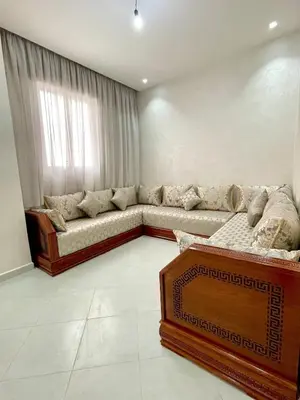 a living room with a couch and a window at The White House Tetouan in Oulad Akkou