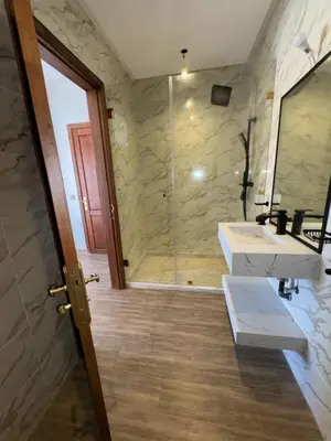 a bathroom with a sink and a shower at villas d'or in Marrakech