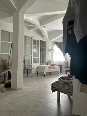 a living room with a couch and a table at Á 800m de la Marina Bay Tanger in Oulad Akkou
