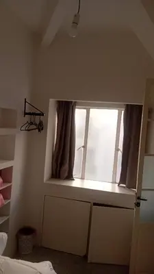 a window in a bedroom with a window sill at Á 800m de la Marina Bay Tanger in Oulad Akkou