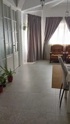 a living room with a couch and a table at Á 800m de la Marina Bay Tanger in Oulad Akkou