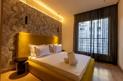 a bedroom with a bed and a large window at Modern 3BR with High Amenities and Stylish Decor in Oulad Akkou