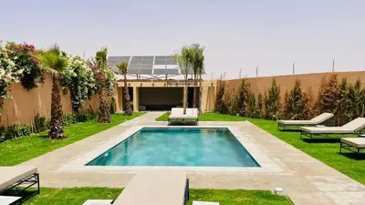 a swimming pool in the middle of a yard at Villa Marwa 3ch private Marrakech in Marrakech