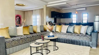 a living room with a couch and two tables at Villa Marwa 3ch private Marrakech in Marrakech