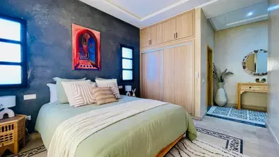 a bedroom with a large bed in a room at Villa Marwa 3ch private Marrakech in Marrakech