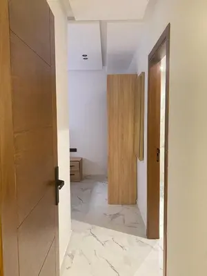 an open door in a room with a hallway at Modern Equipped Central Suite terassa 8 in Oulad Akkou
