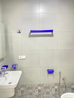 a white bathroom with a sink and a toilet at Modern Family Home Ful Equipped in Oulad Akkou