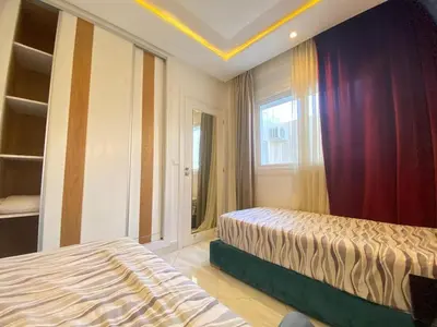 a bedroom with two beds and a window at Modern Family Home Ful Equipped in Oulad Akkou