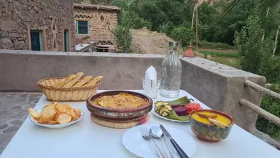 a white table with food on top at Gîte Jamal taghia in Taghia
