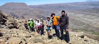 a group of people standing on top of a mountain at Gîte Jamal taghia in Taghia