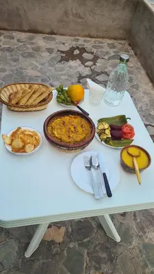 a white table with food on top of it at Gîte Jamal taghia in Taghia