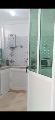 a white door in a kitchen with a window at Stay 5 minutes from Fes airport in Oulad Tayeb