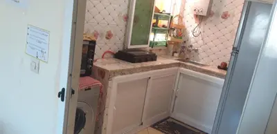a bathroom with a sink and a washing machine at Stay 5 minutes from Fes airport in Oulad Tayeb
