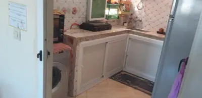 a kitchen with a sink and a washing machine at Stay 5 minutes from Fes airport in Oulad Tayeb