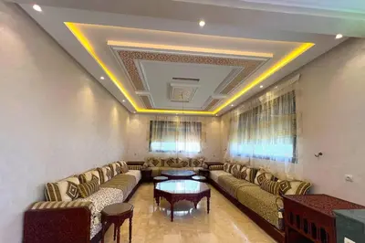 a living room with couches and a table at luxury villa ourika in Oulad Akkou