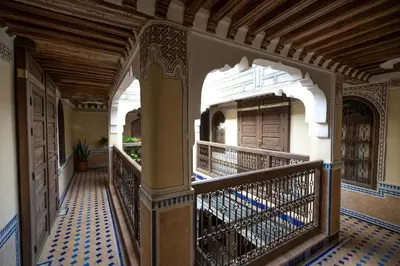 a hallway of a house with a balcony at Saphiryad in Fès