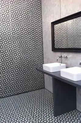 a bathroom with two sinks and a mirror at JMEL B&b