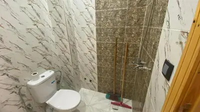 a bathroom with a toilet and a shower at Near University Balcony in Fès