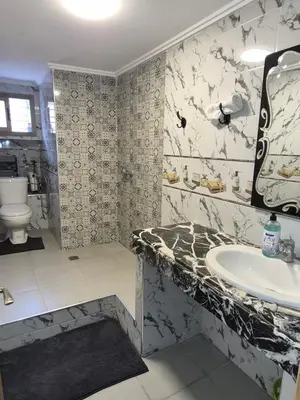 a bathroom with a sink and a toilet at Villa avec piscine-Meknès in Oulad Akkou