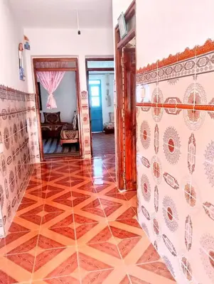 a hallway of a house with a tile floor at Dar Hayoun in Oulad Akkou