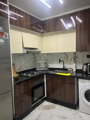 a kitchen with a sink and a stove top oven at Very nice modern air-conditioned apartment in Fez in Fès