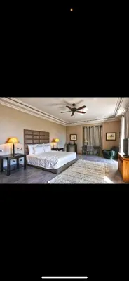 a large bedroom with a bed and a ceiling fan at Villa Marrakech in Oulad Akkou